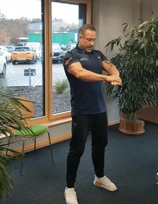 Andreas Marcello-Ferrara conducting a digital office workout at the TUP Campus