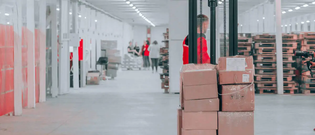 Forklift in a warehouse. Photo by Jake Nebov on Unsplash - seTS7bvcr0A