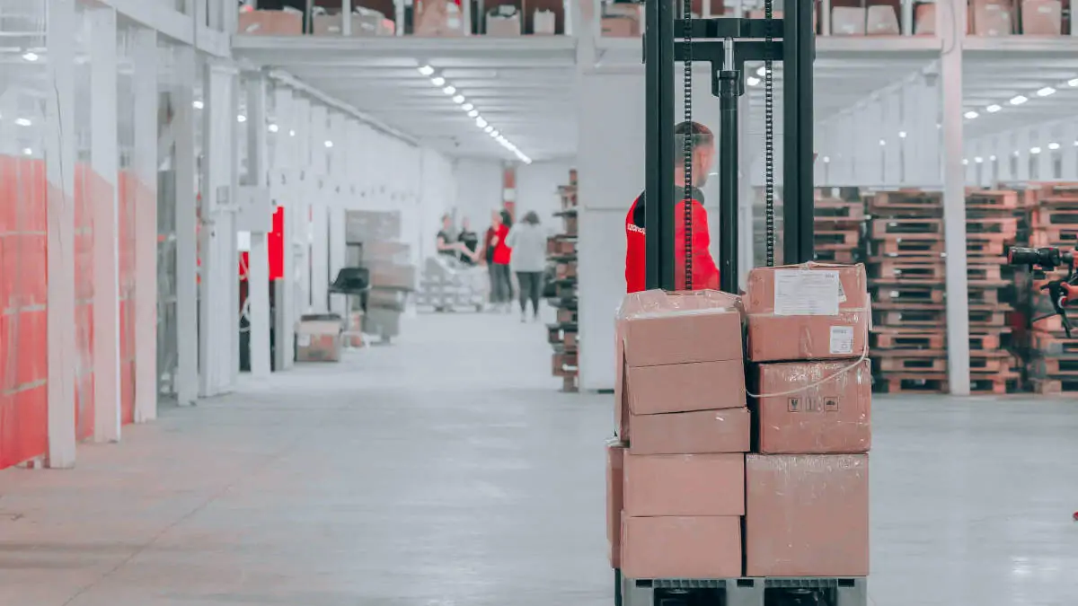 Forklift in a warehouse. Photo by Jake Nebov on Unsplash - seTS7bvcr0A